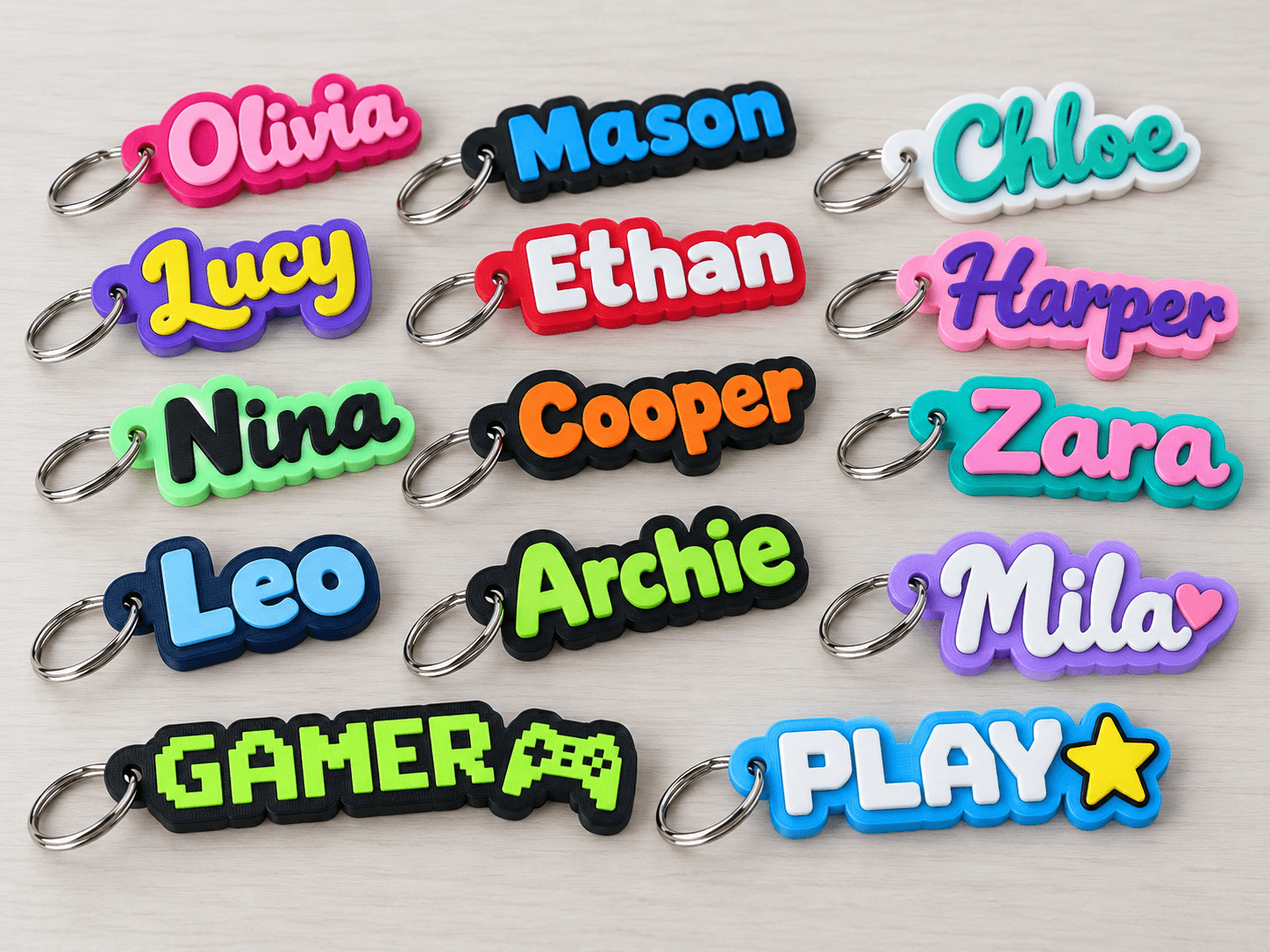 Colourful custom 3D printed name keyrings in assorted fonts and colour combinations